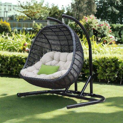 HomeRoots 69" Beige and Black Aluminum Indoor Outdoor Swing Chair with Beige Cushion